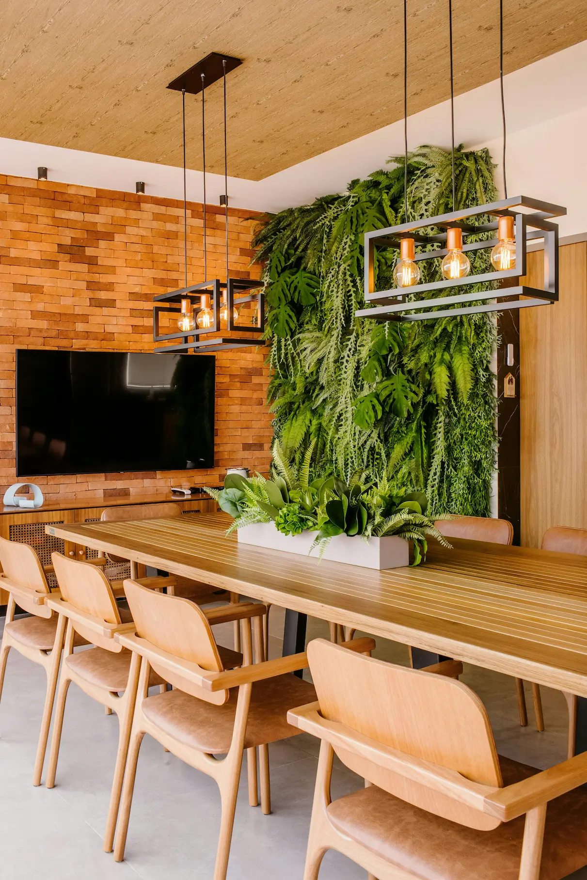 Biophilic office design featuring natural elements, abundant greenery, and a harmonious, open layout that promotes well-being and connection to nature.