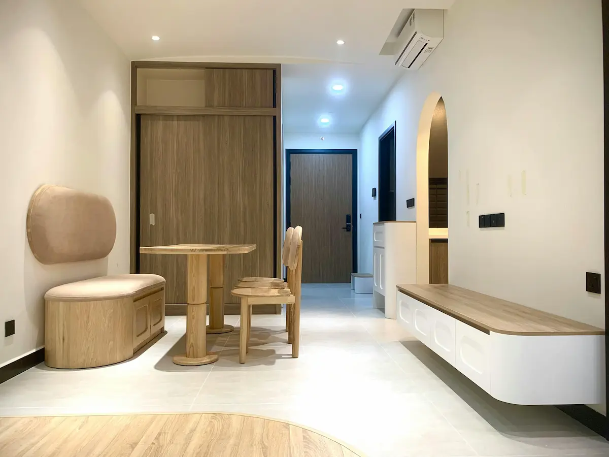 Living room with built-in seating and storage, blending comfort and functionality in a minimalist style.