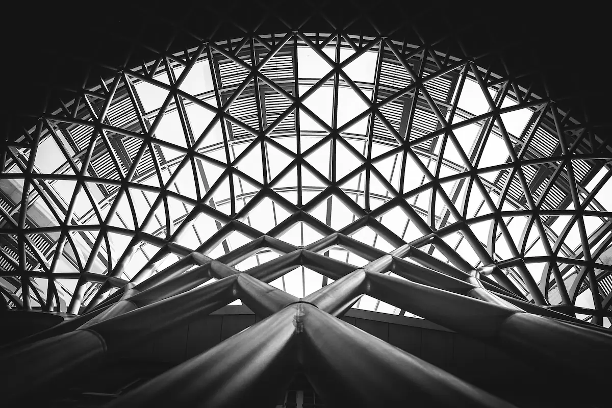 A grayscale metal building showcasing its structure and design elements.
