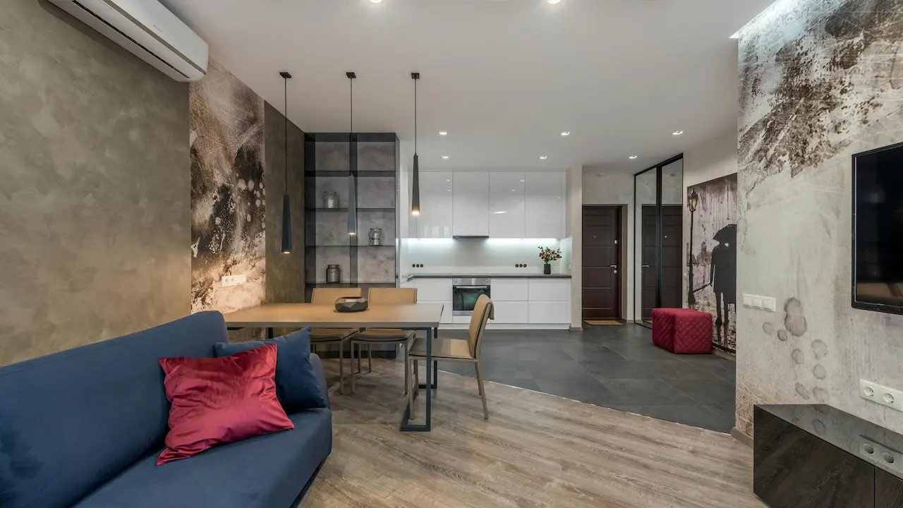 modern apartment with sofa and TV in living room and kitchen