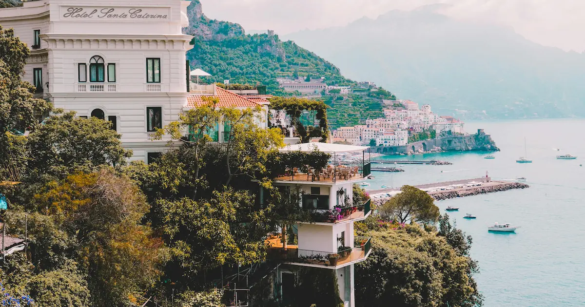 Modern Mediterranean house on cliff overlooking the beach in Amalfi, Campania, Italy.