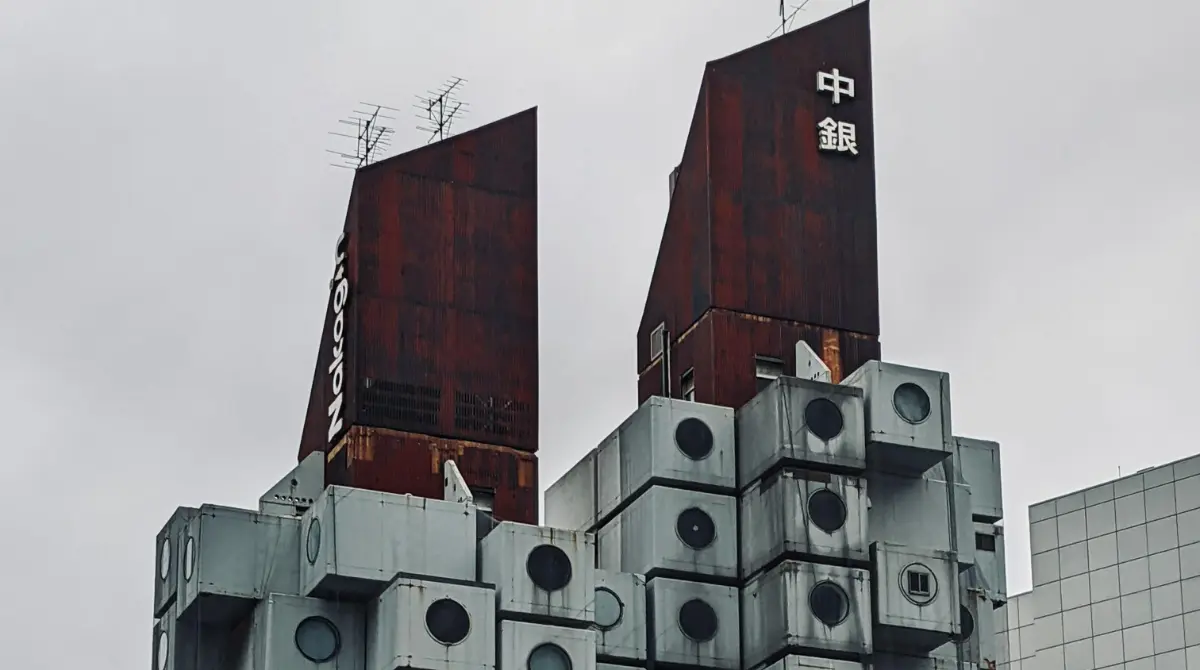 Nakagin Capsule Tower in Tokyo, showcasing Metabolism architecture with modular units.