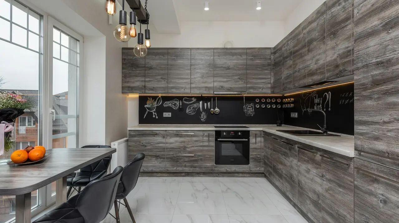 Stylish kitchen interior featuring a large window and modern decor.