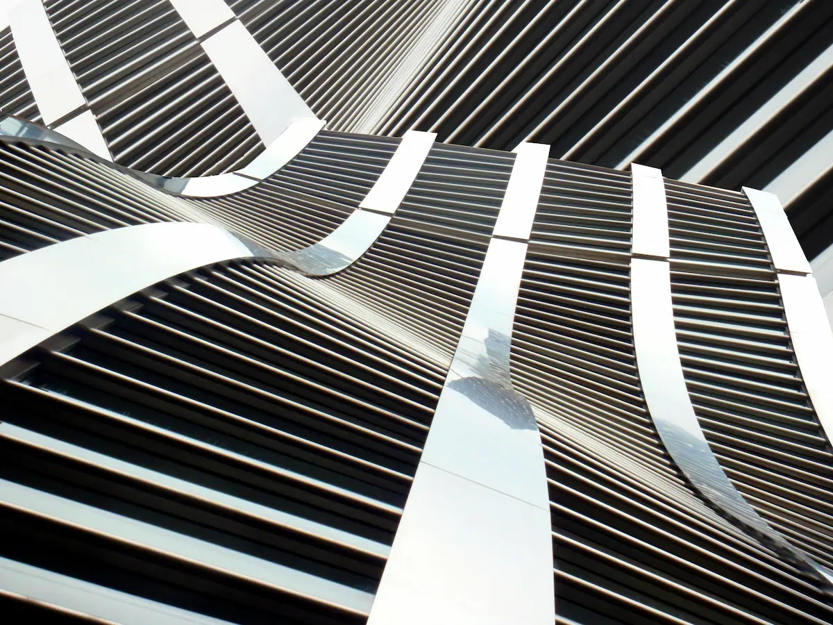 Urban collision of metal in modern architecture, blending sleek metal elements with bold, contemporary design.