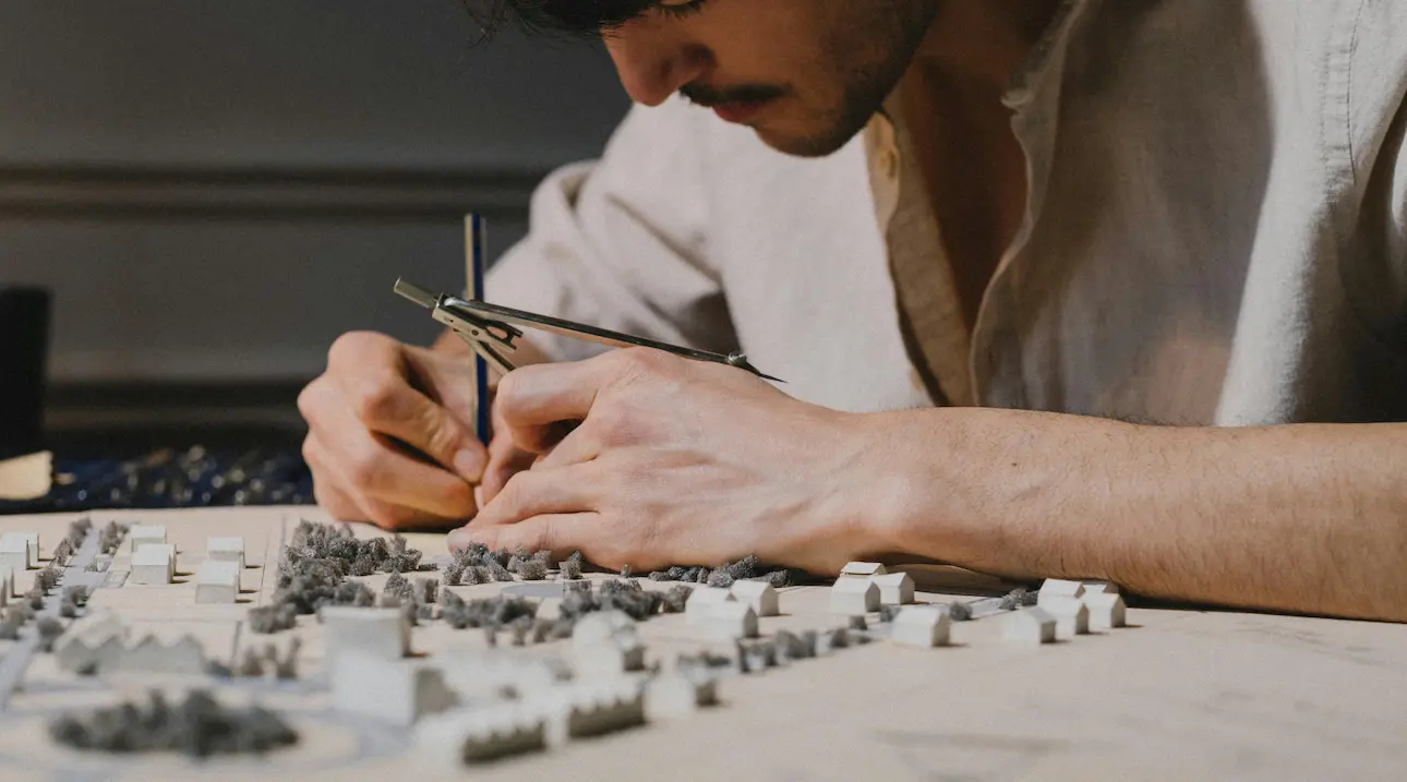 Essential tools for architectural model making, including cutting tools, adhesives, and precision instruments for detailed design work.