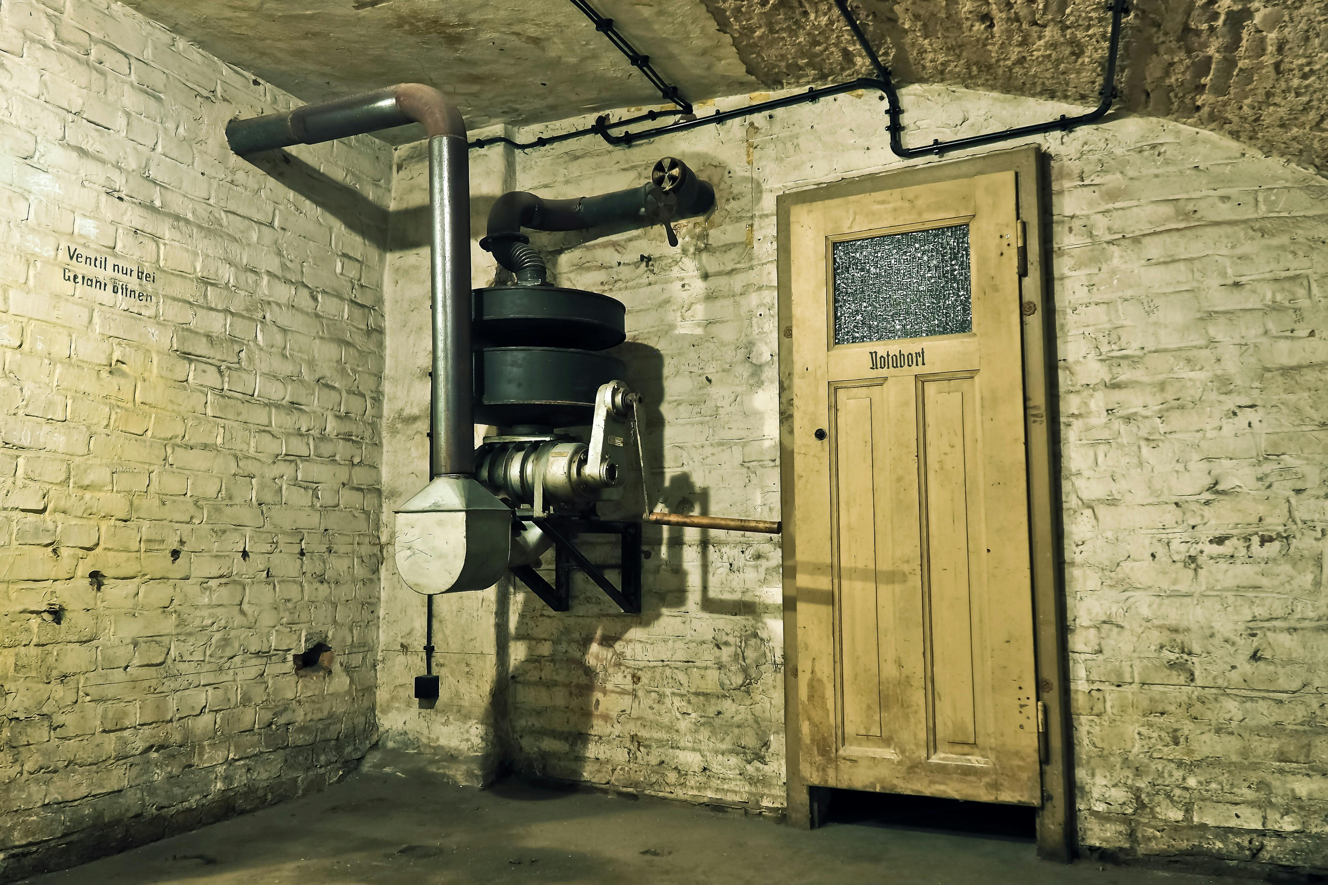 1940s basement room with a large metal machine, industrial and vintage in style.