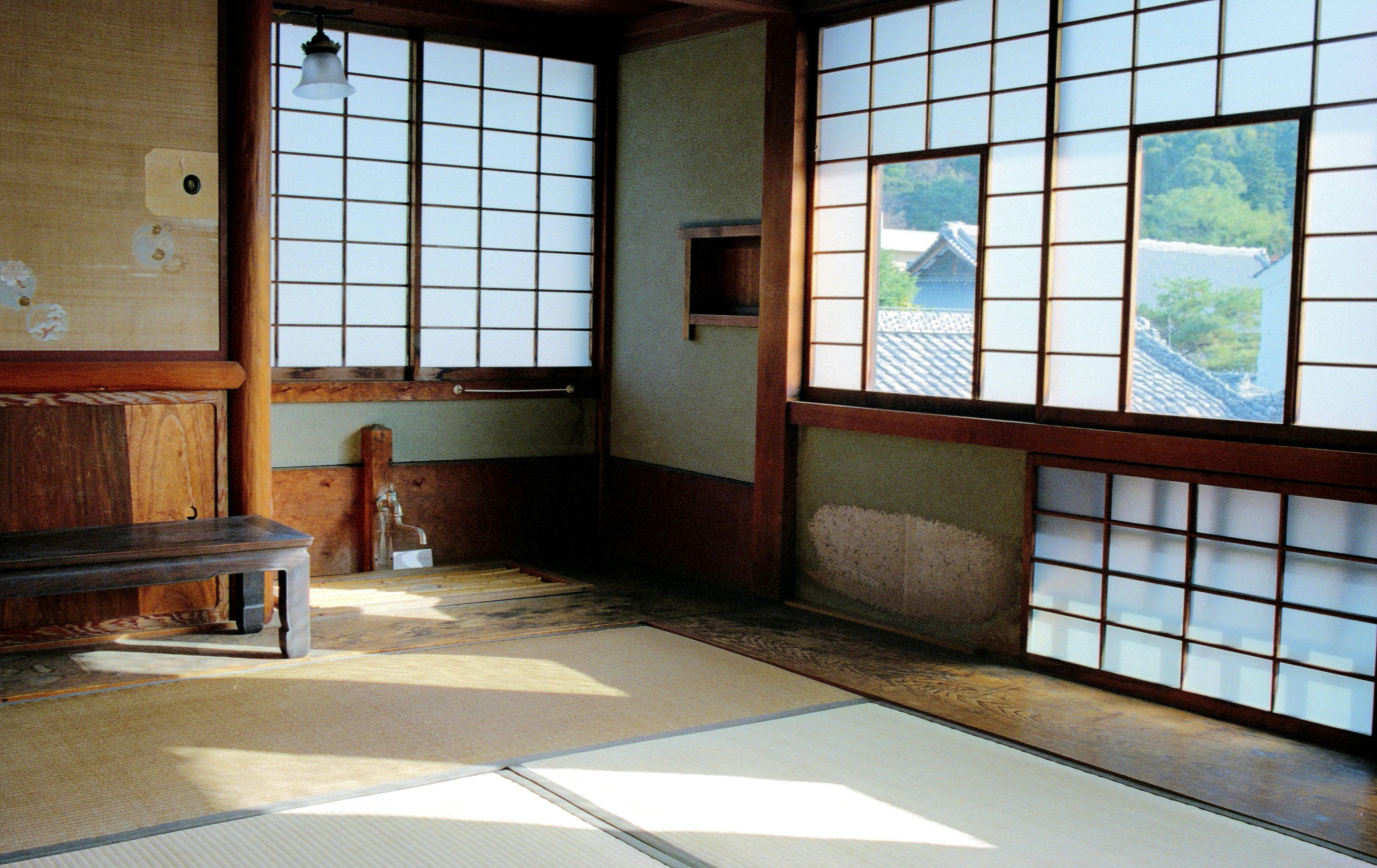 Tranquil traditional Washitsu interior with tatami and soft lighting.