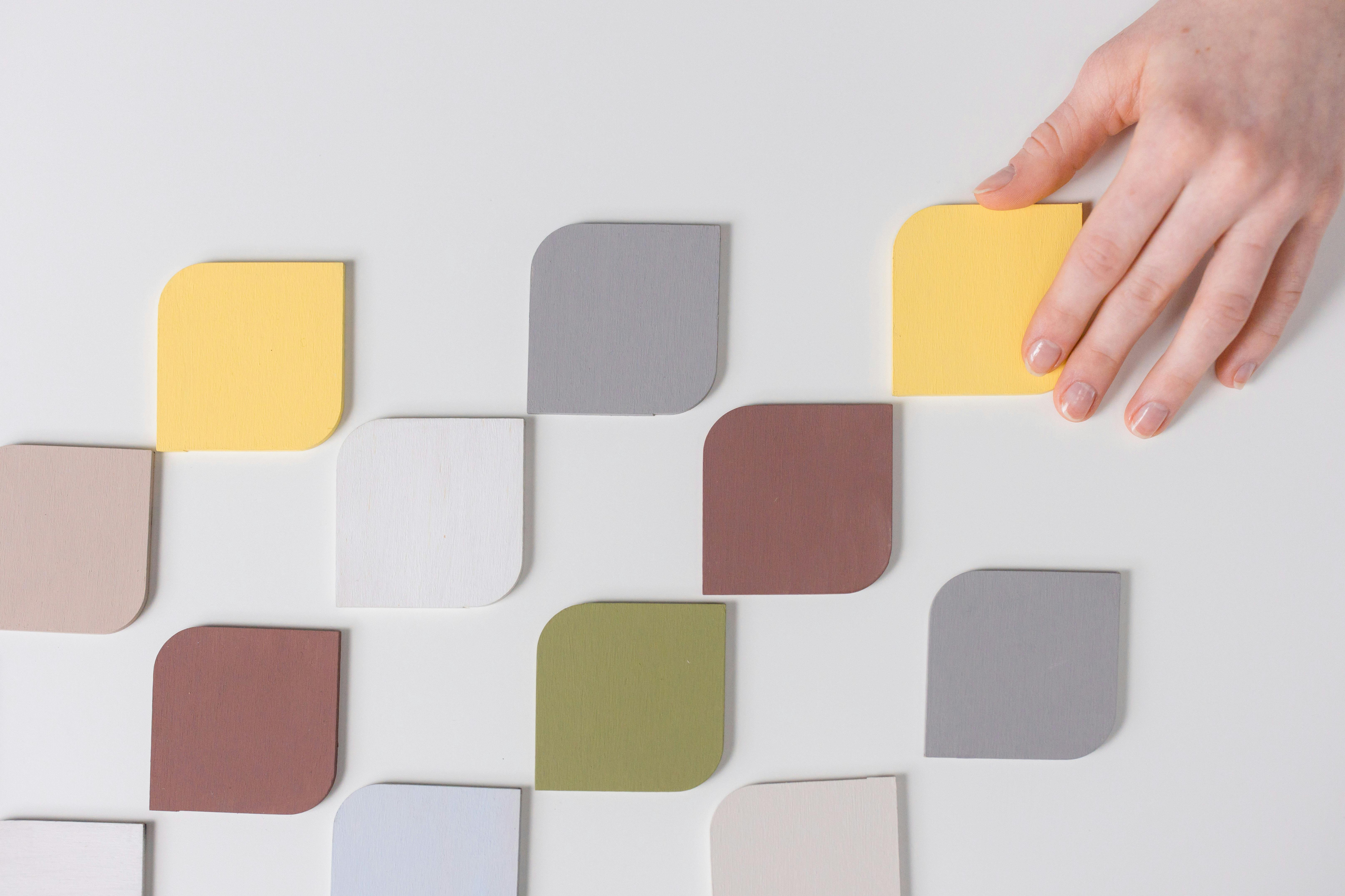 Person selecting one color from many