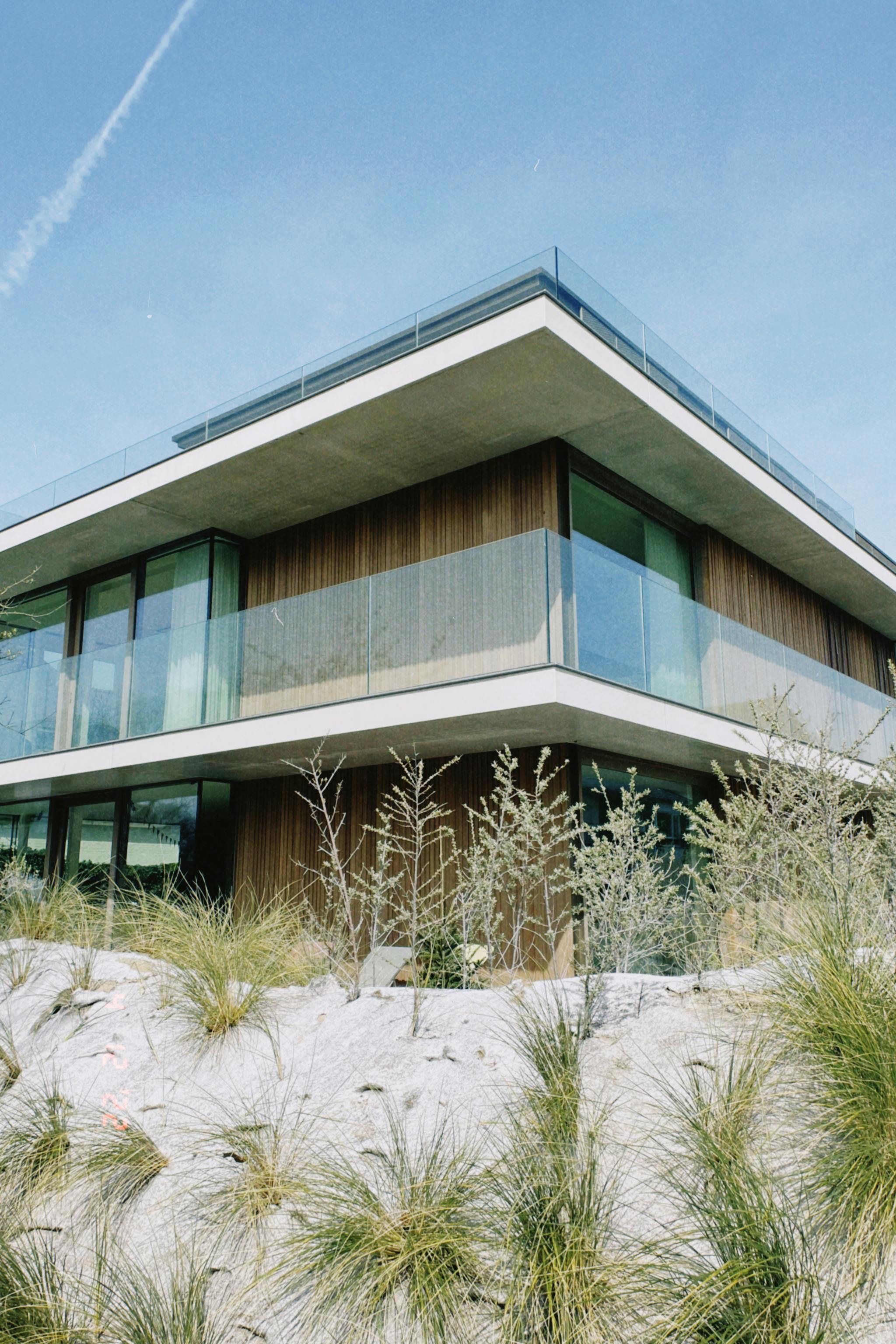 Modern villa concept in the desert, featuring sleek design and large windows with a focus on open spaces.