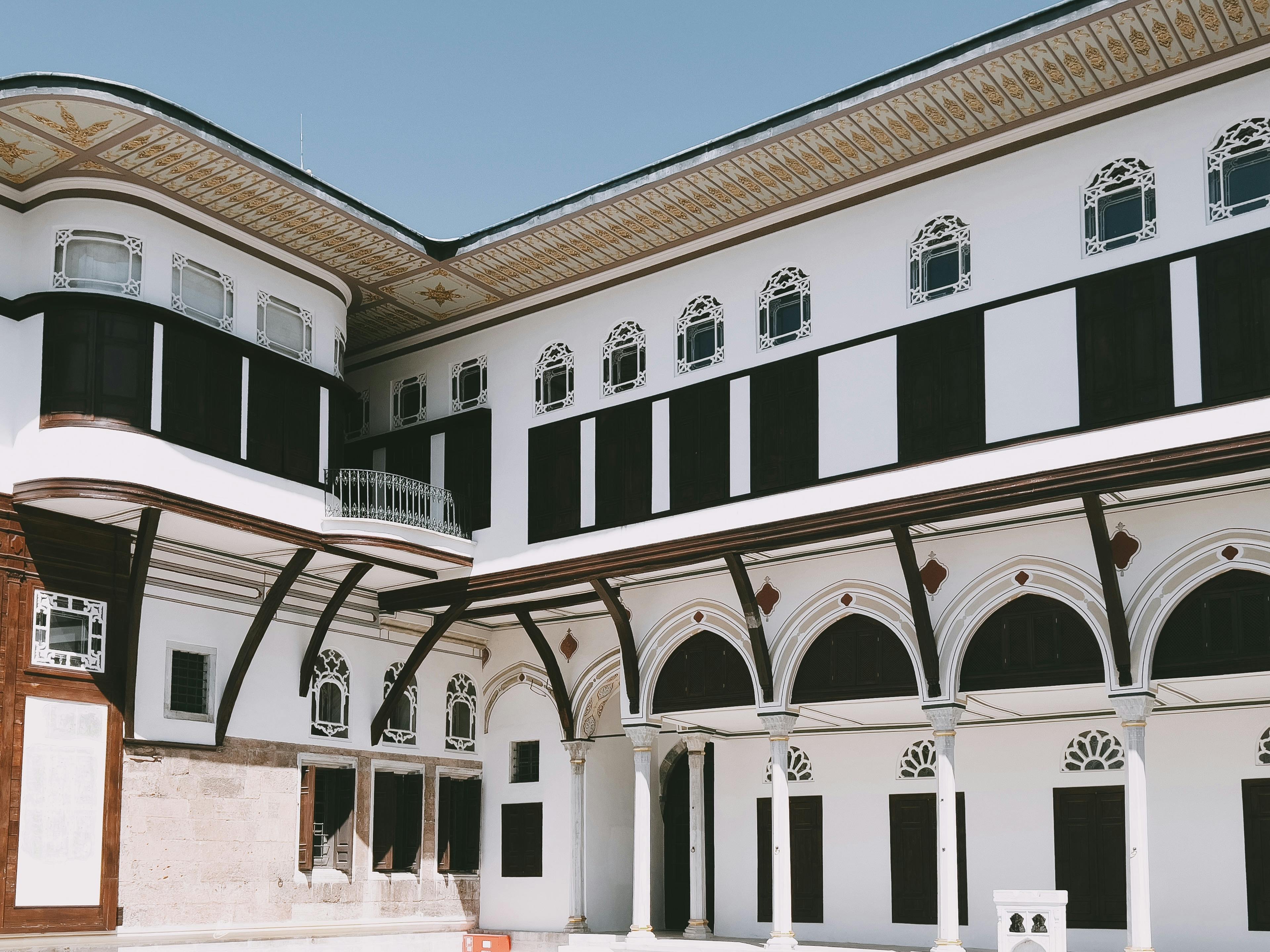 White wall of Topkapi Palace with arched openings.