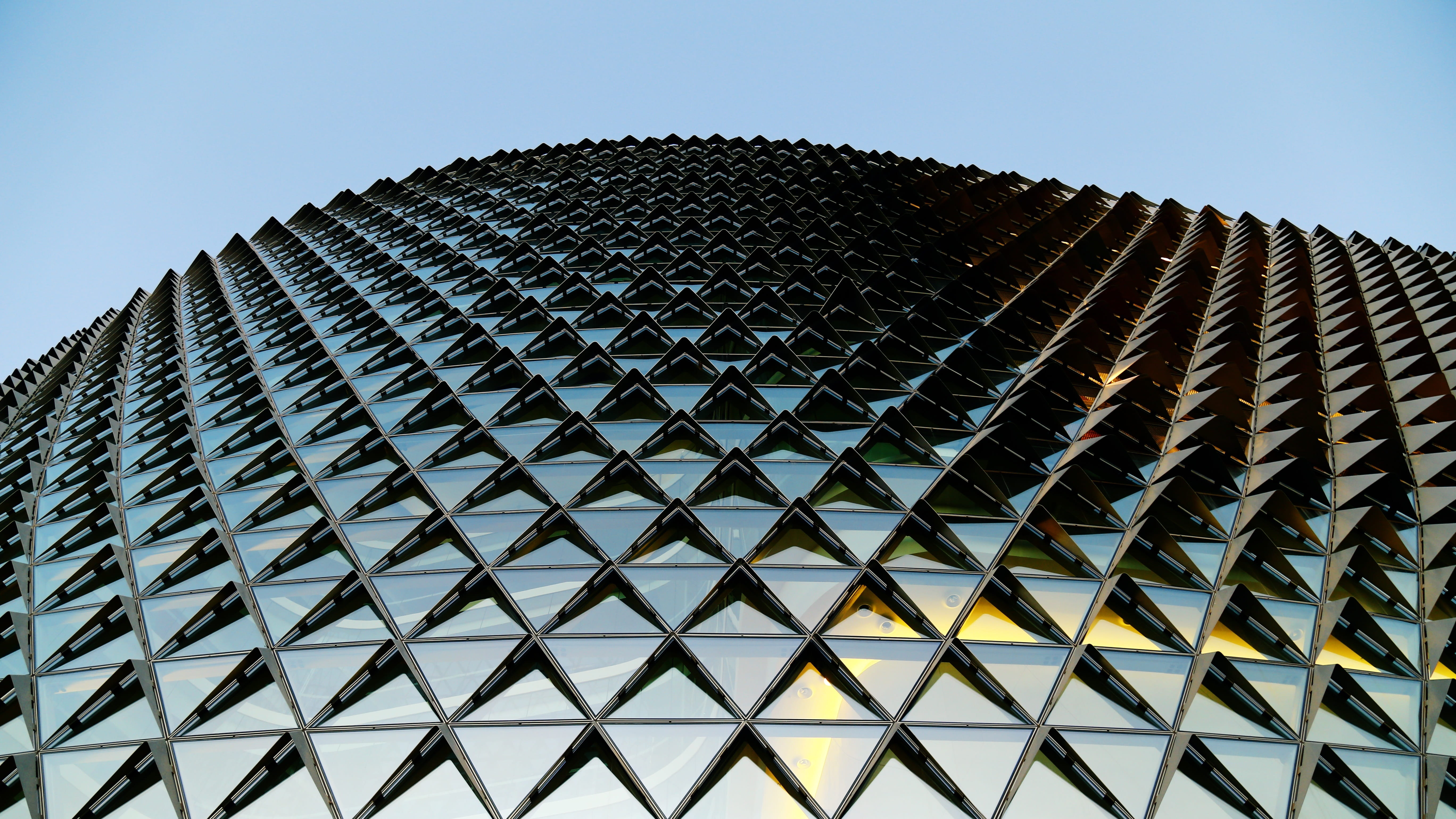 Modern glass and steel facade with repeating pattern.