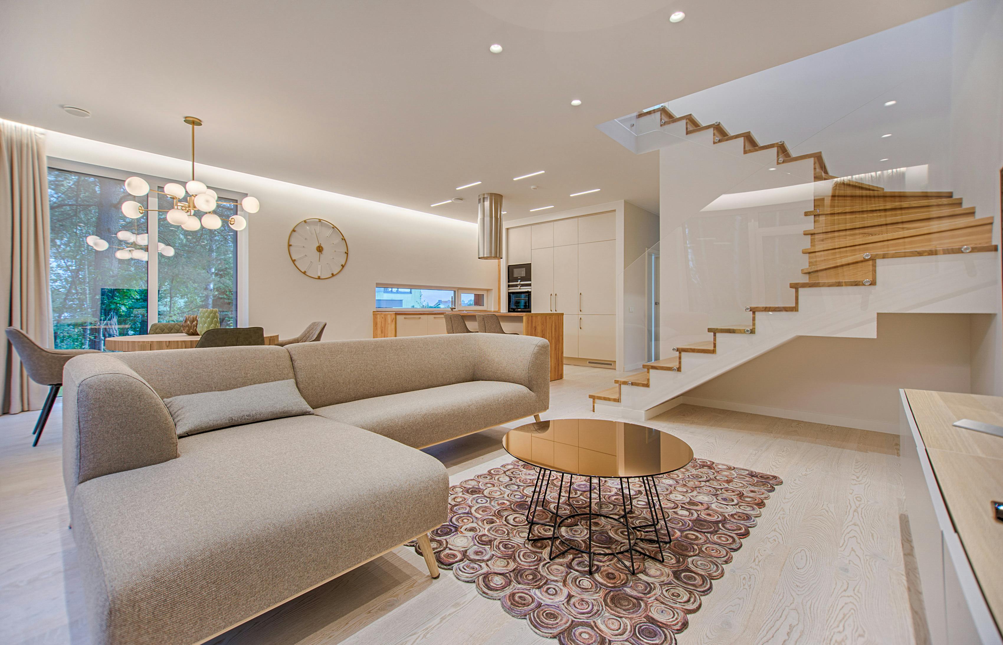 Modern Vilnius house interior with clean lines, natural light, and smart materials for comfort and style.