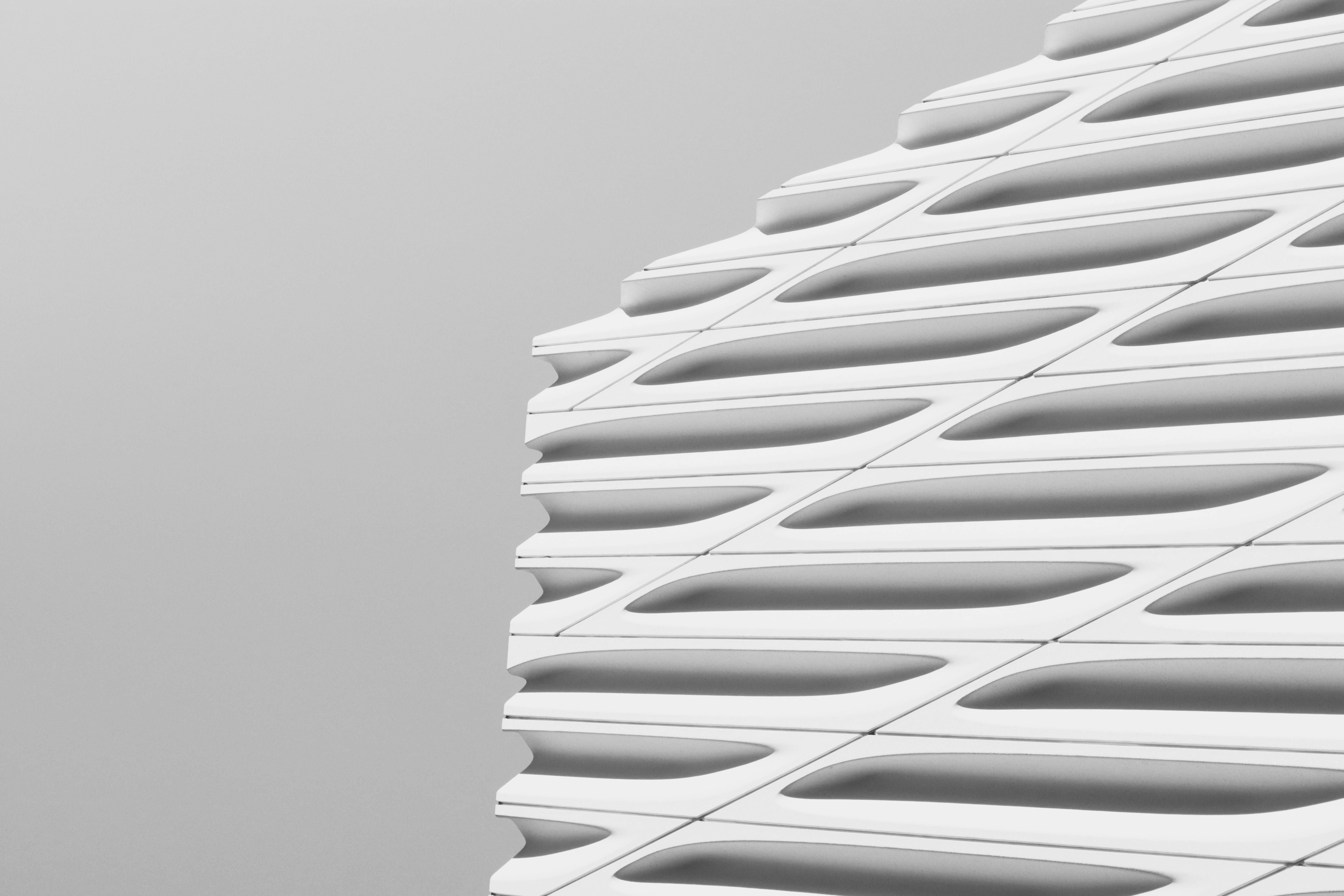 Contemporary building facade featuring clean white geometric design.