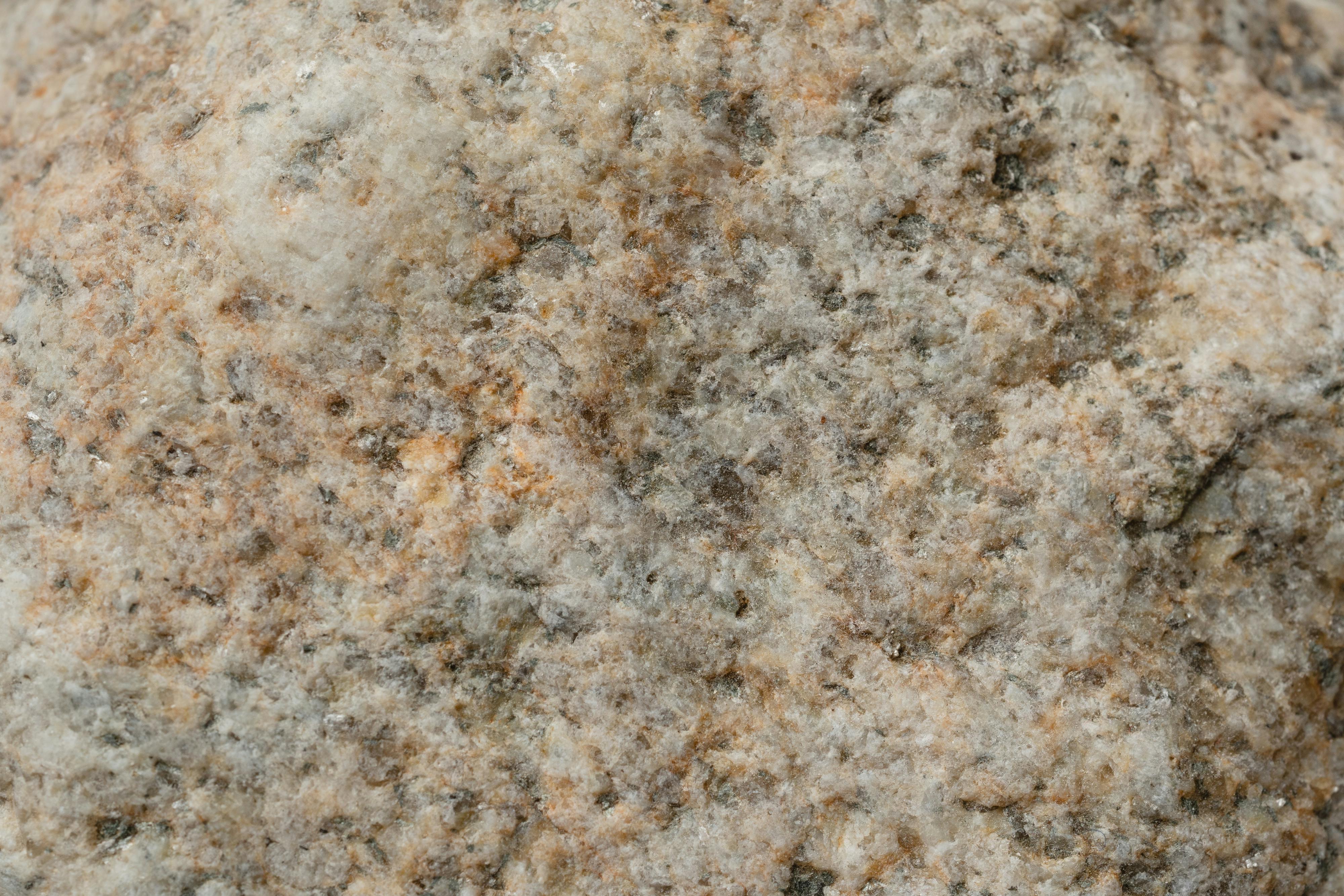 Close-up view of granite rock surface showing natural grain and texture.