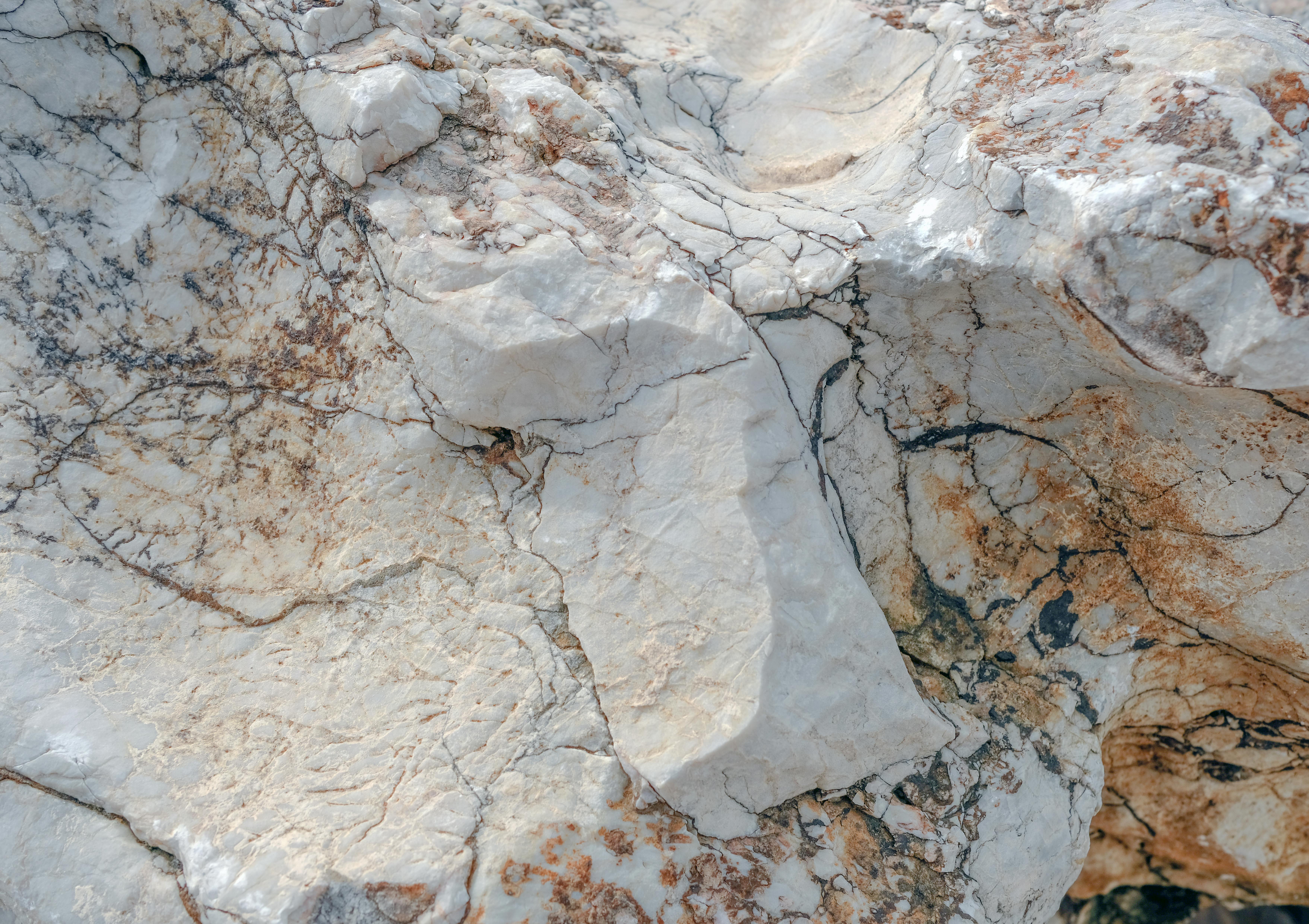 Unfinished granite in rough-cut form before processing.