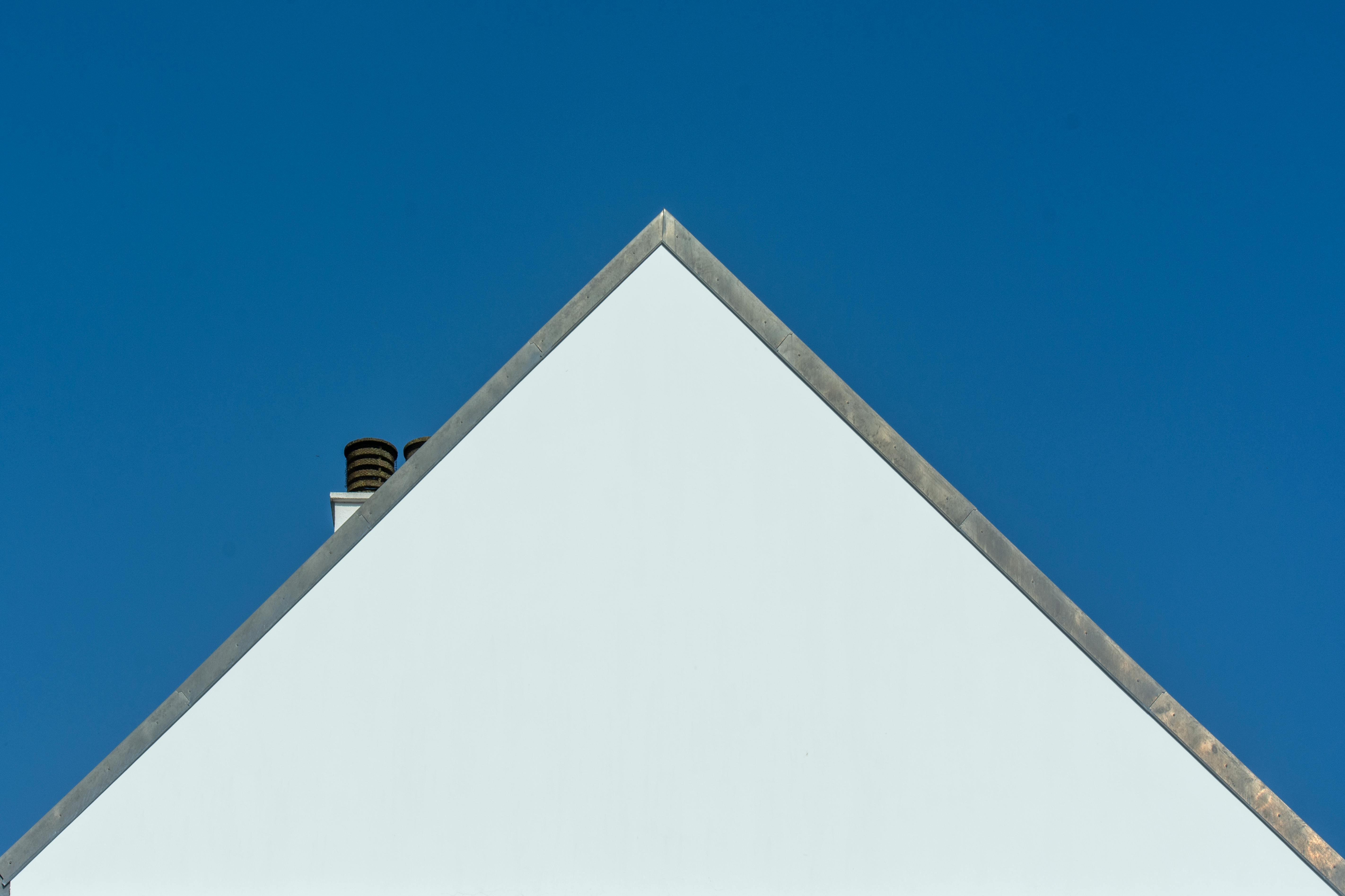 Small white house with simple gable front.