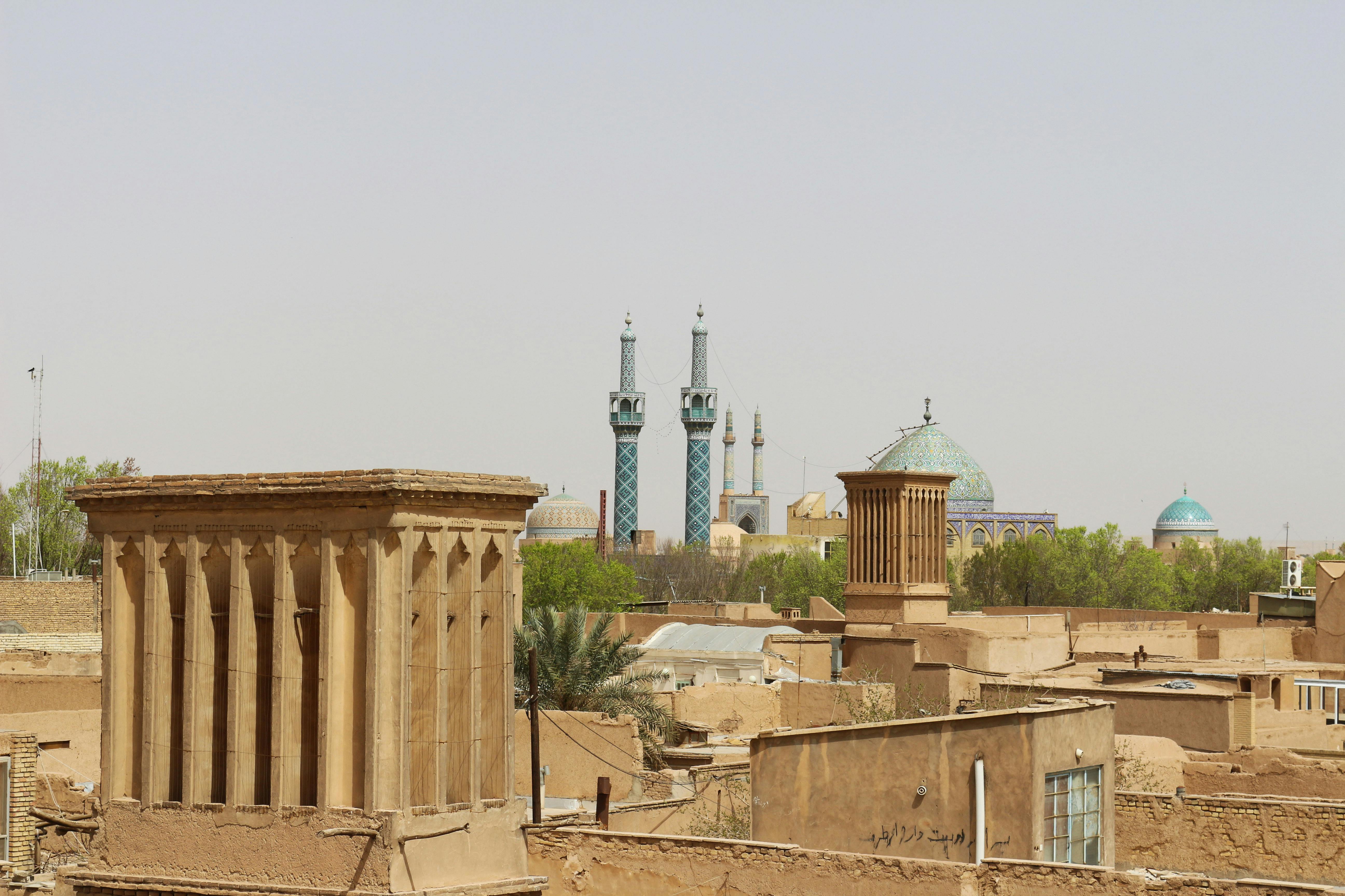 Ancient stone windcatchers and mosque domes in Yazd, Iran.