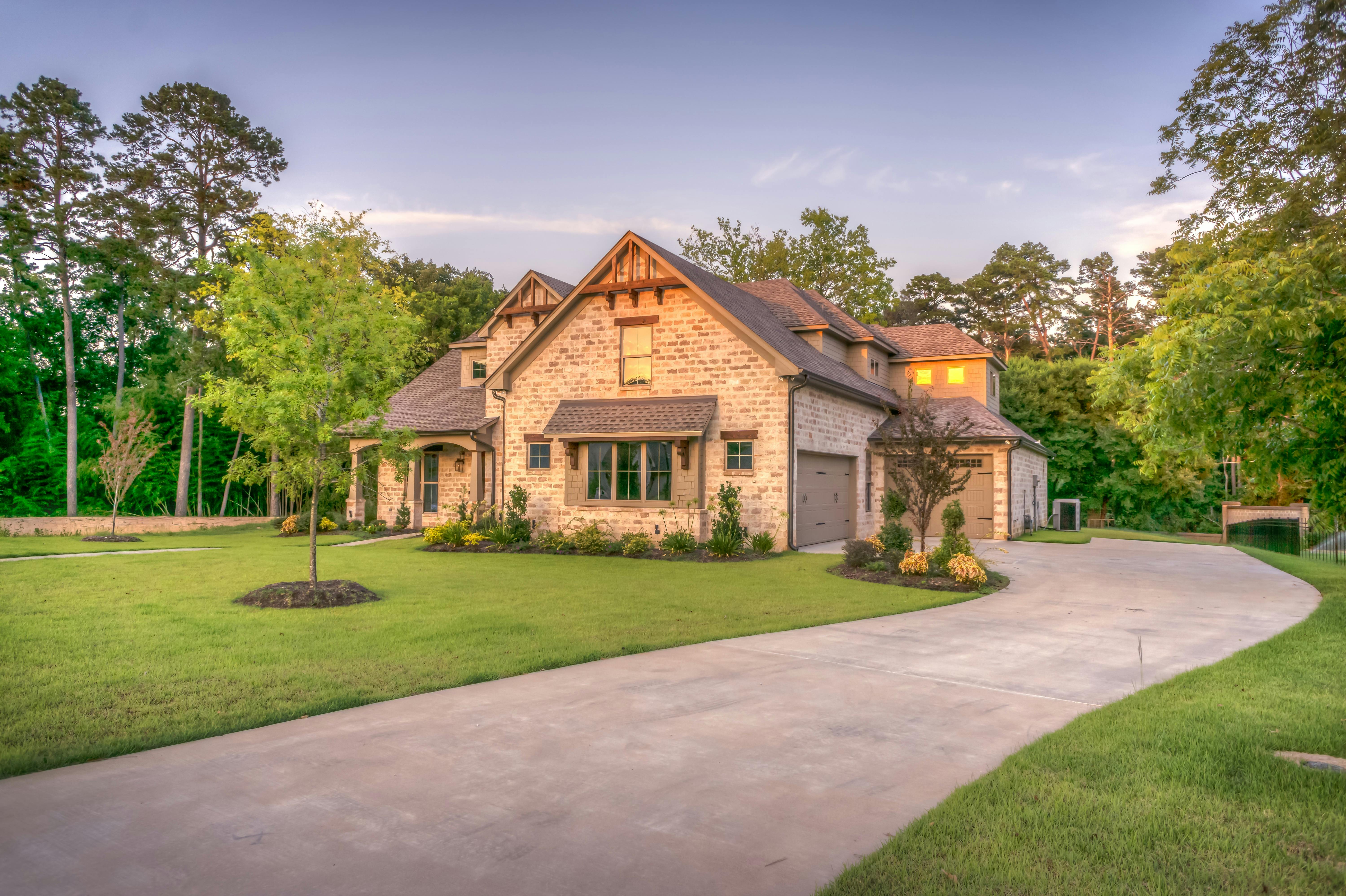 Single-story beige bungalow with sloped roof.