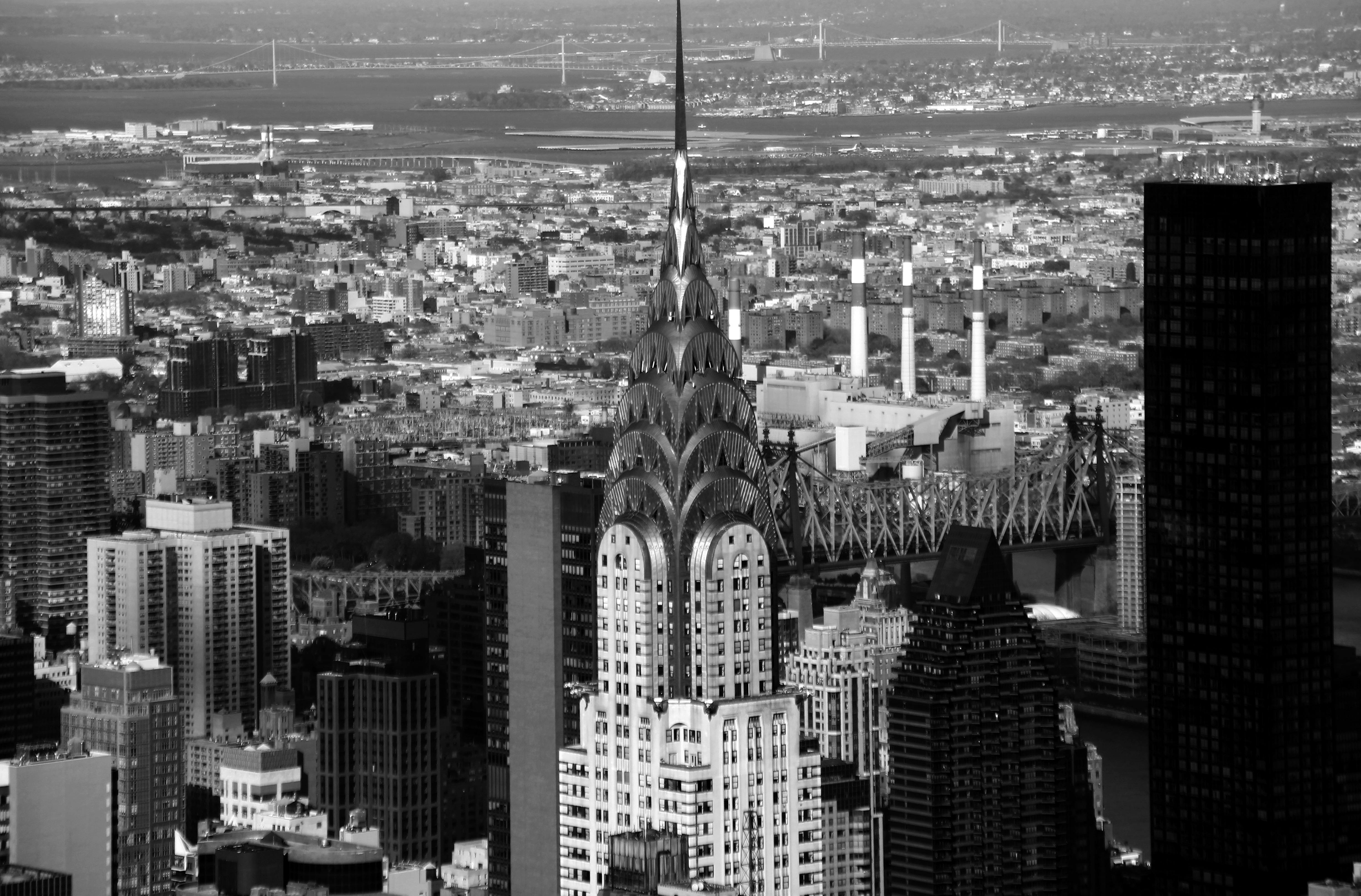 Aerial shot of the Chrysler Building in New York City, showing Art Deco detailing with metallic forms and vertical rhythm echoing industrial-era optimism.