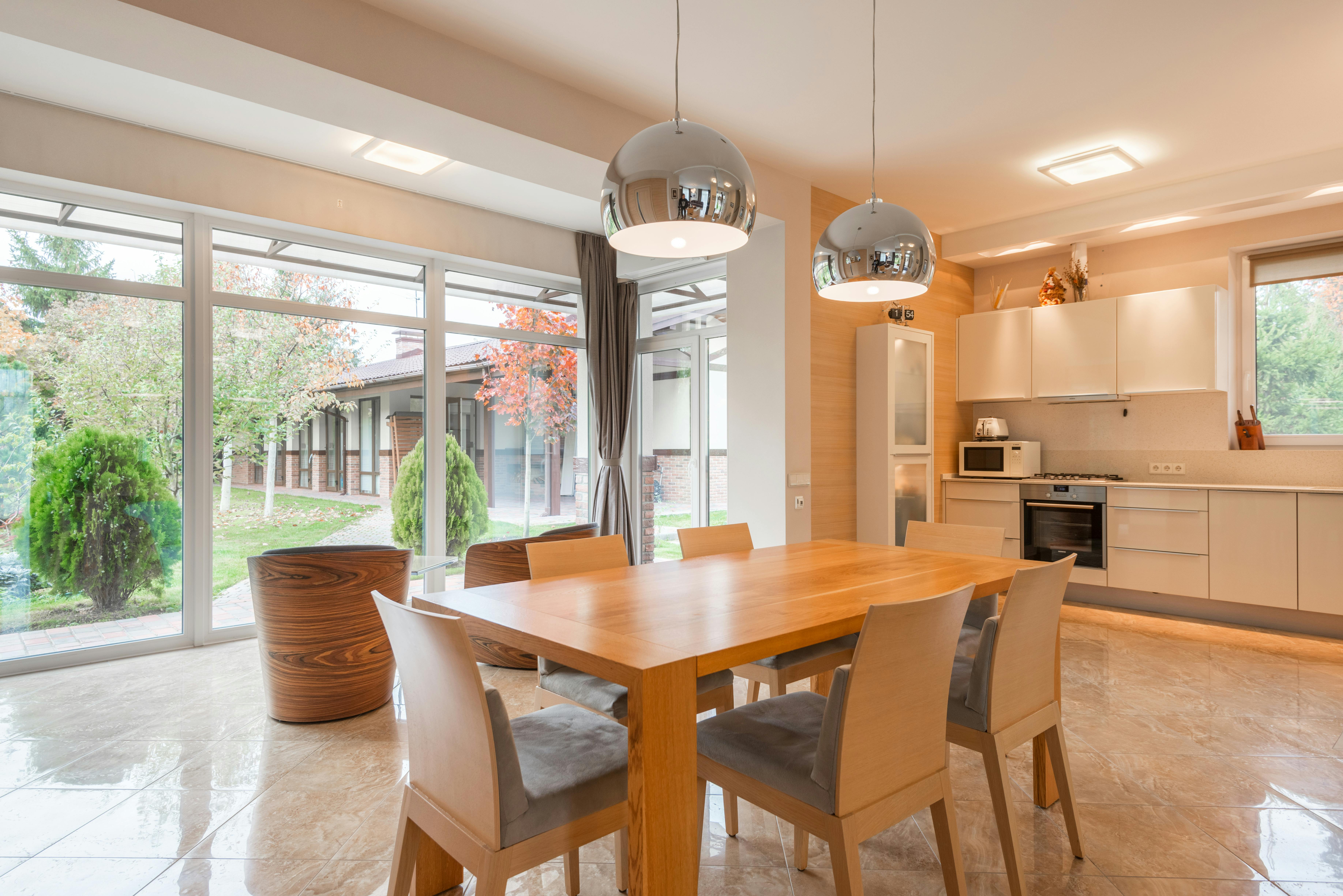 Dining and kitchen area with panoramic windows.