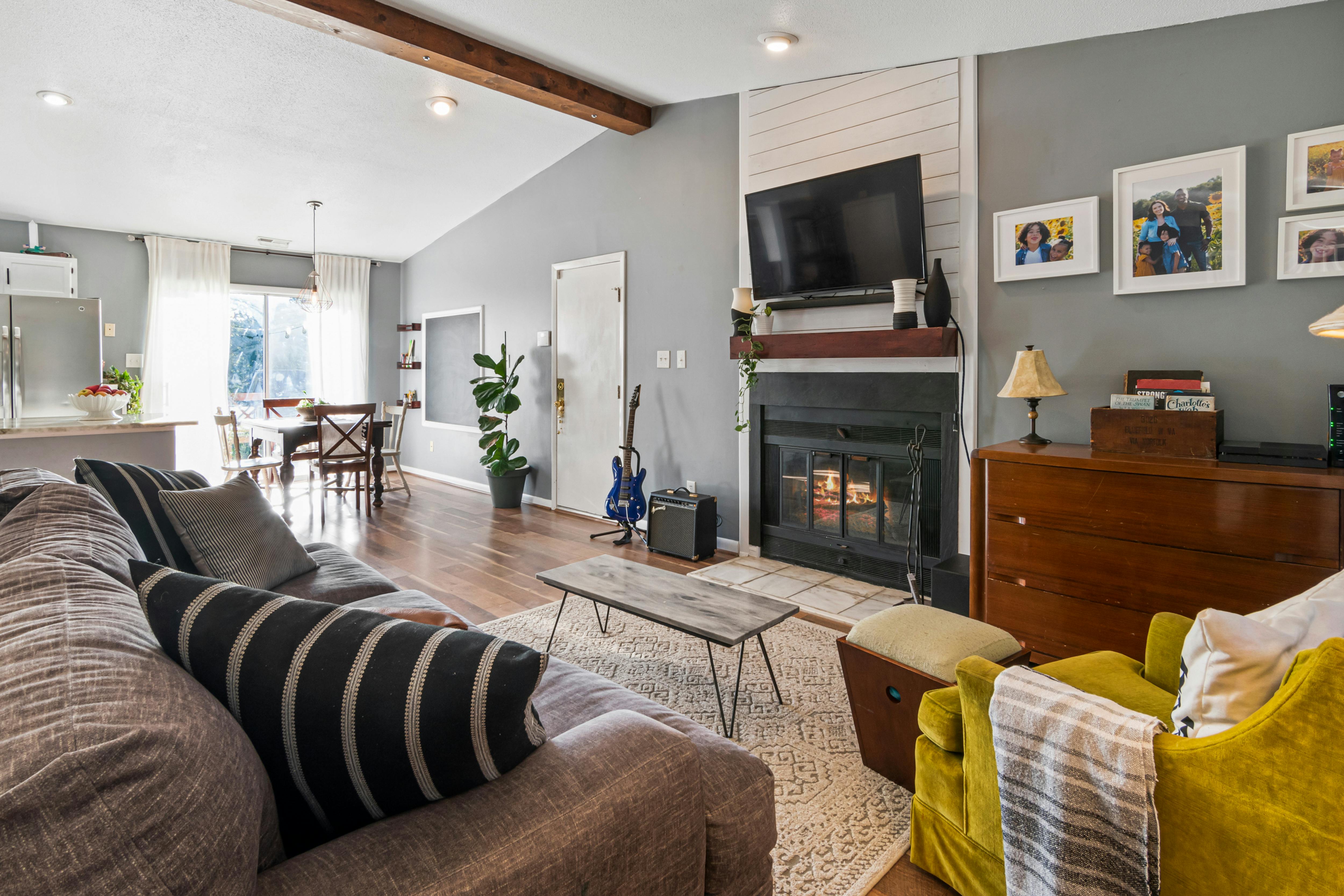 Renovated mid-century living room with fireplace.