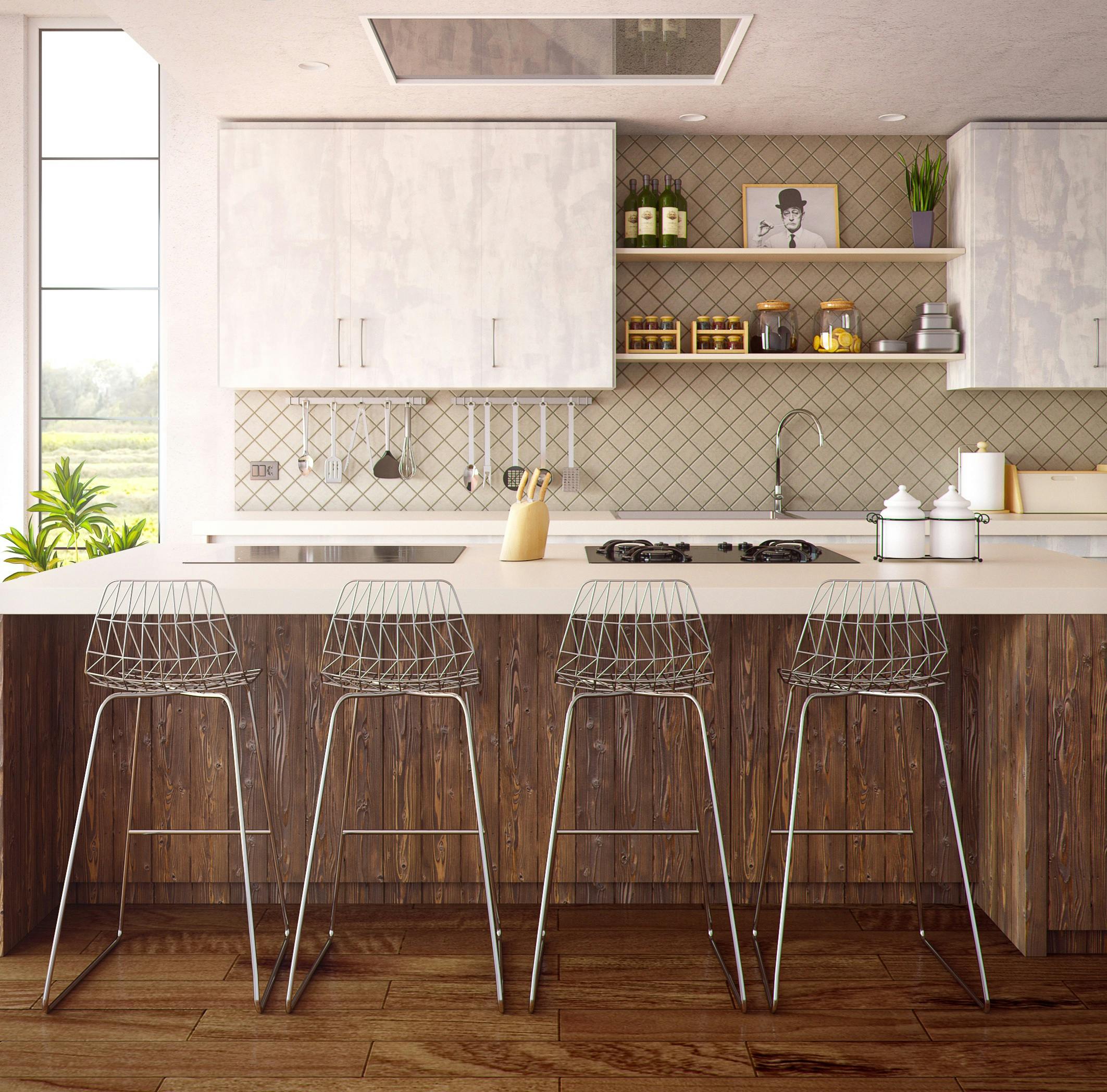 Modern kitchen with four gray bar stools at countertop.