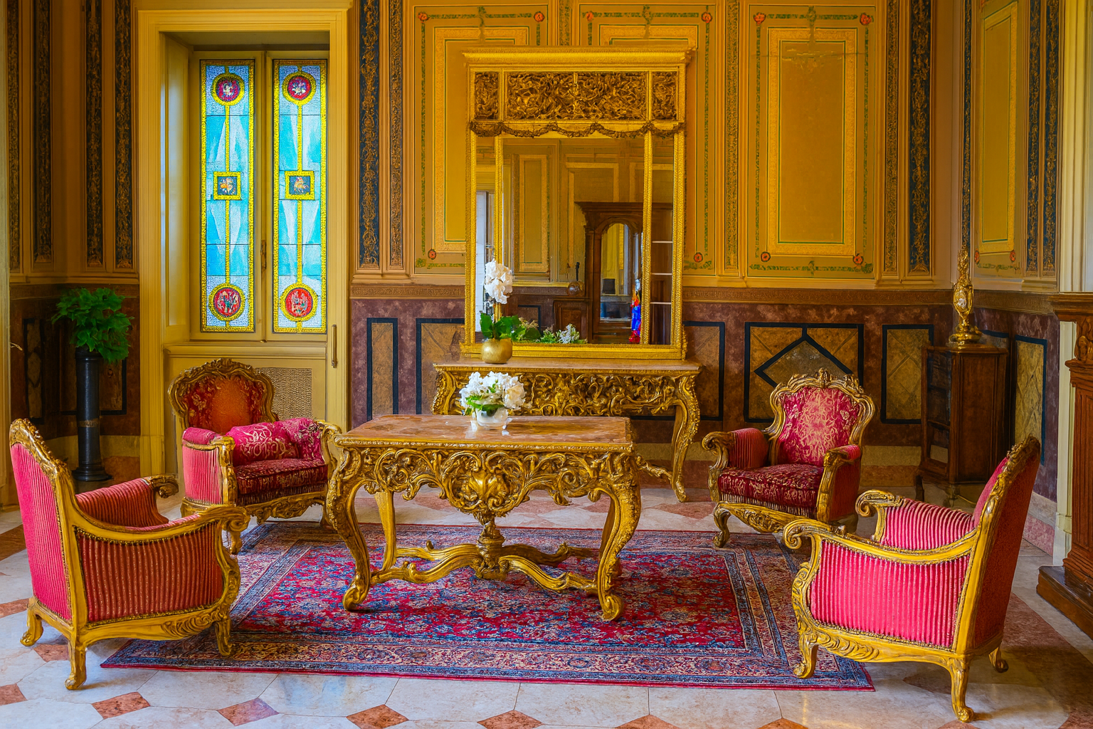 Luxury Victorian living room with ornate furniture and rich décor.