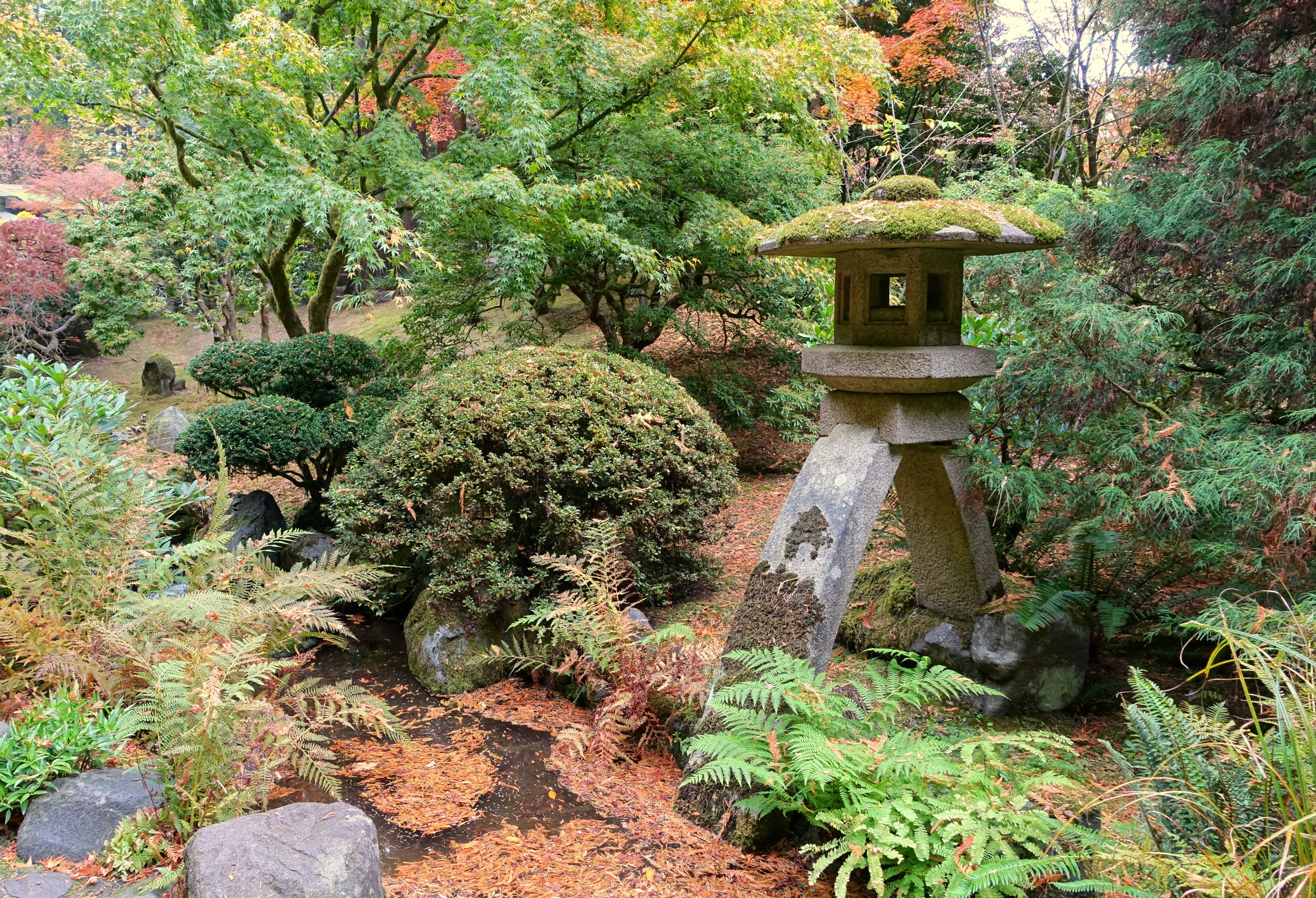 View of Portland Japanese Garden in Oregon with landscaped greenery, stone paths, and serene natural design.