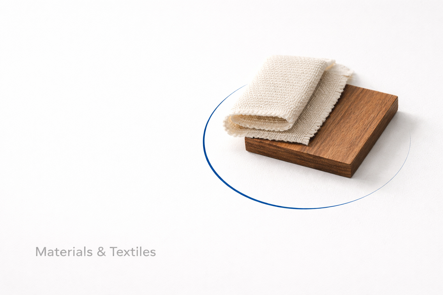 Materials and textiles in interior design featuring fabric swatch and wood samples.