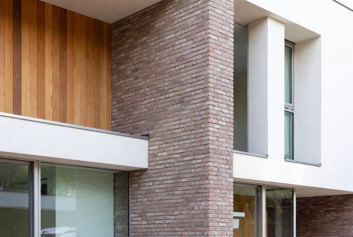 Modern brick feature wall on contemporary residential home with wood, glass and natural light.