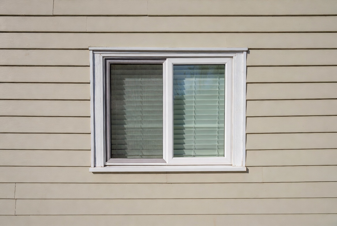 Replacement window set in an upgraded exterior wall during an eco renovation.