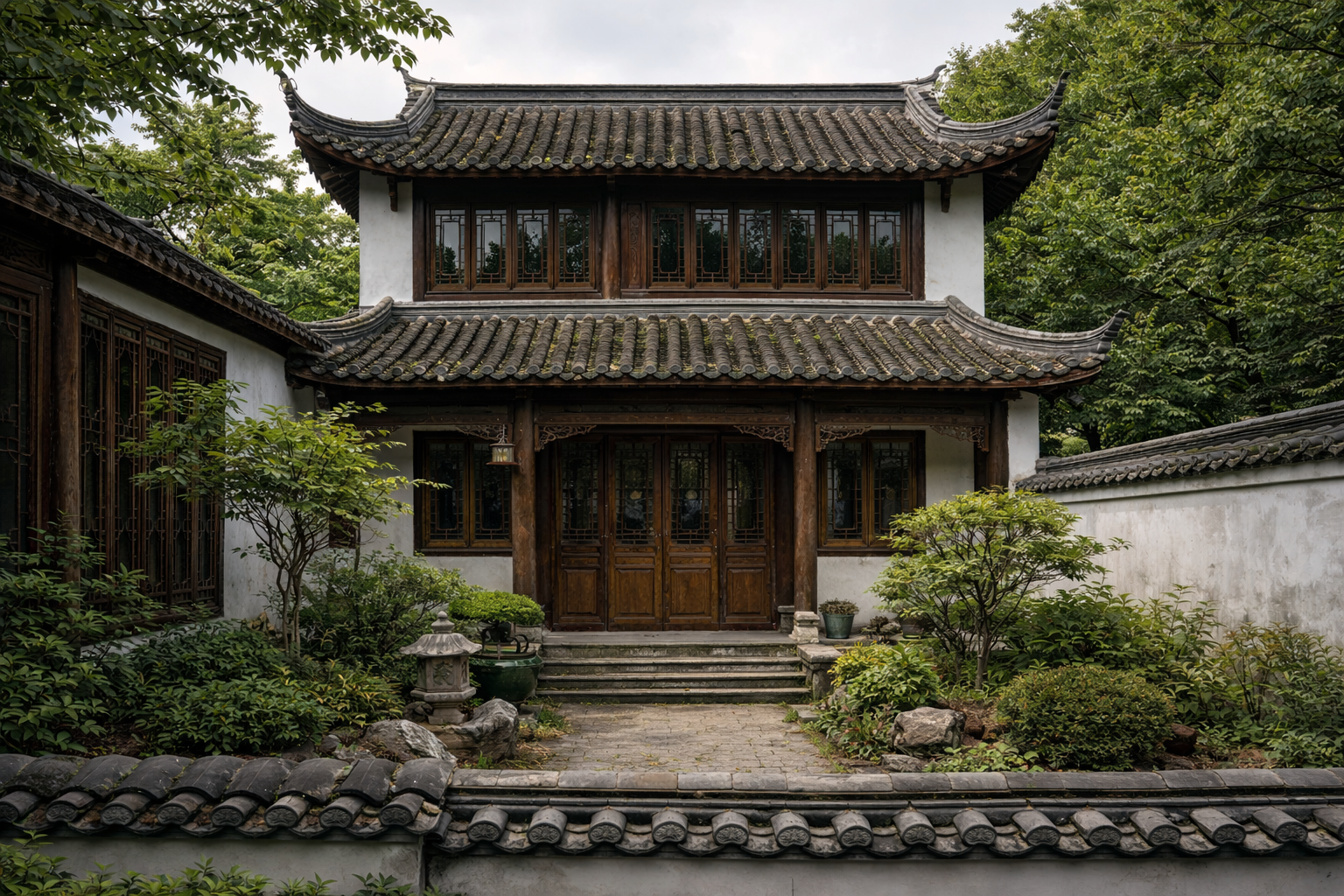 Traditional Chinese courtyard house with curved tiled roof, carved timber detailing, lattice windows, and white plaster walls.