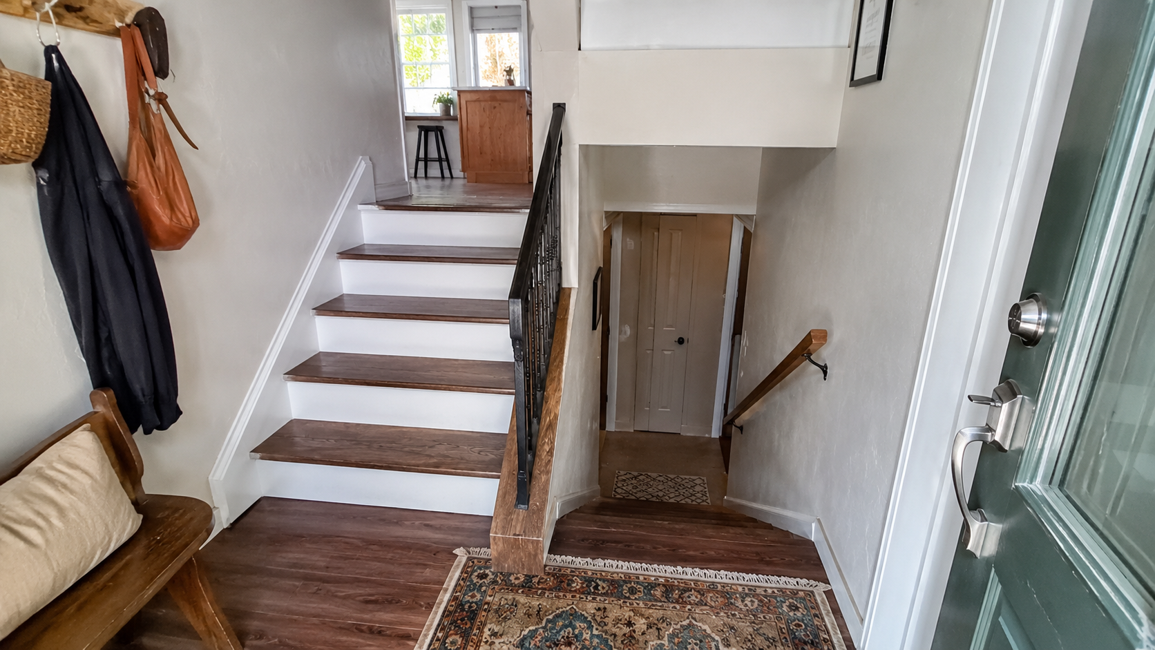 Raised ranch split-entry foyer with stairs up to the main level and down to the lower level.