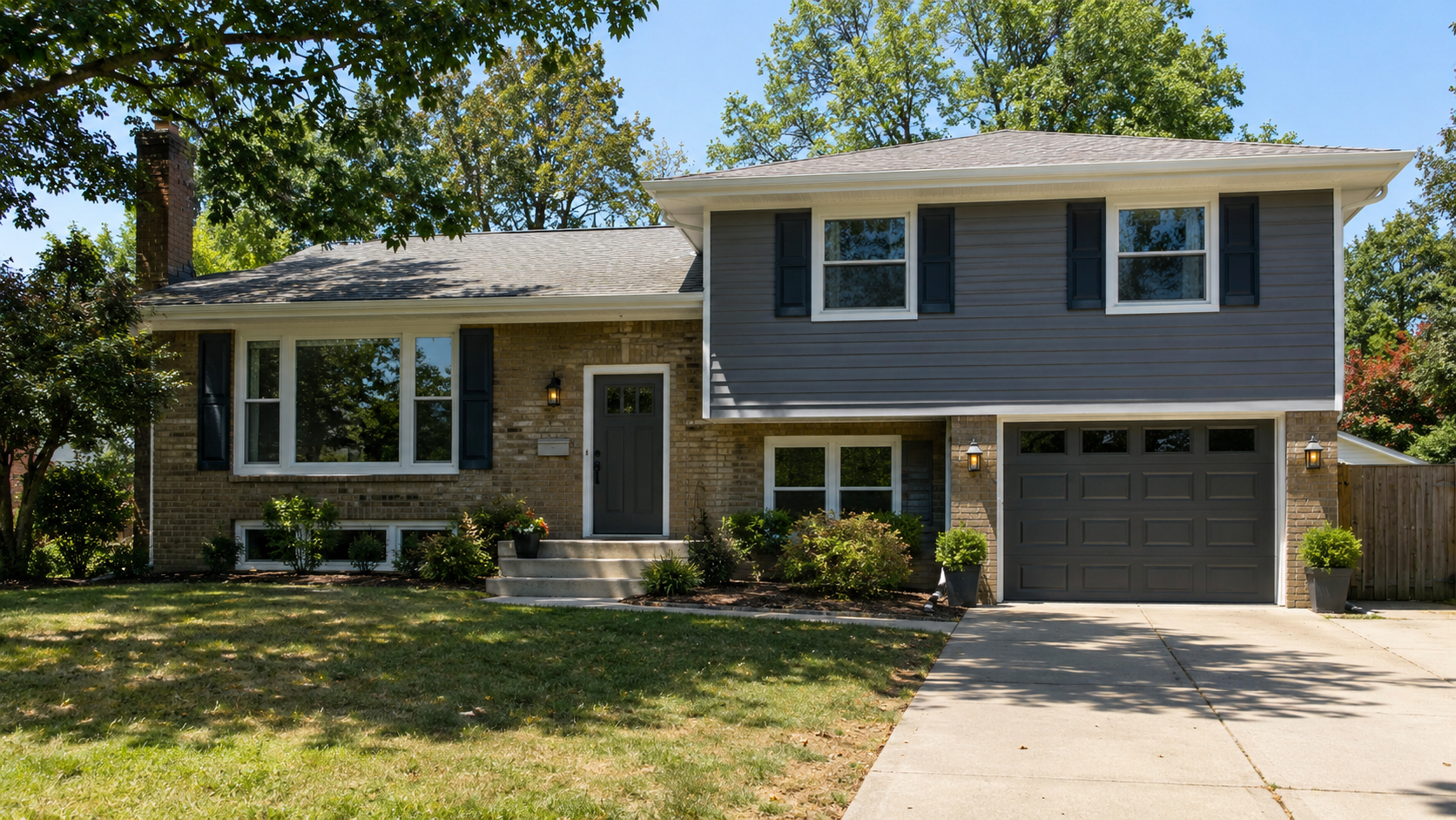 Updated 1970s split level house exterior with stepped massing, cleaner entry, improved garage door, better windows, and restrained materials.