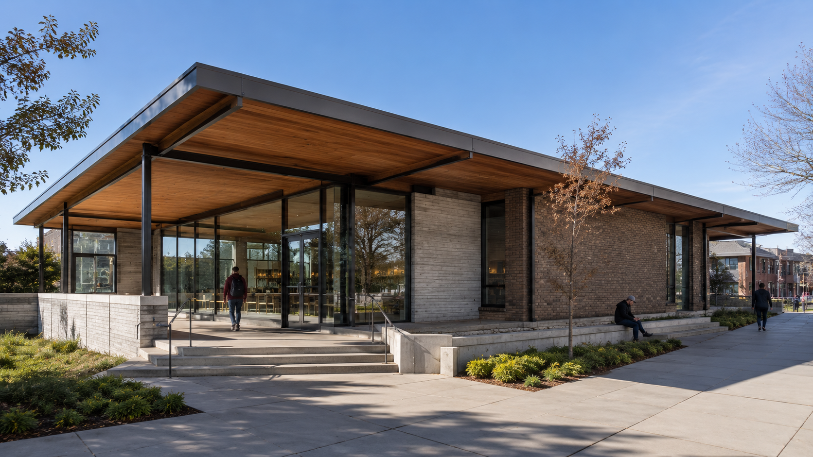 A contemporary public building showing roof planes, wall openings, structure, materials, scale, and circulation.