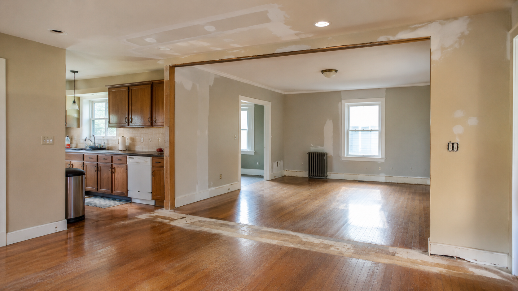 Floor and ceiling repair after removing a wall between two rooms.
