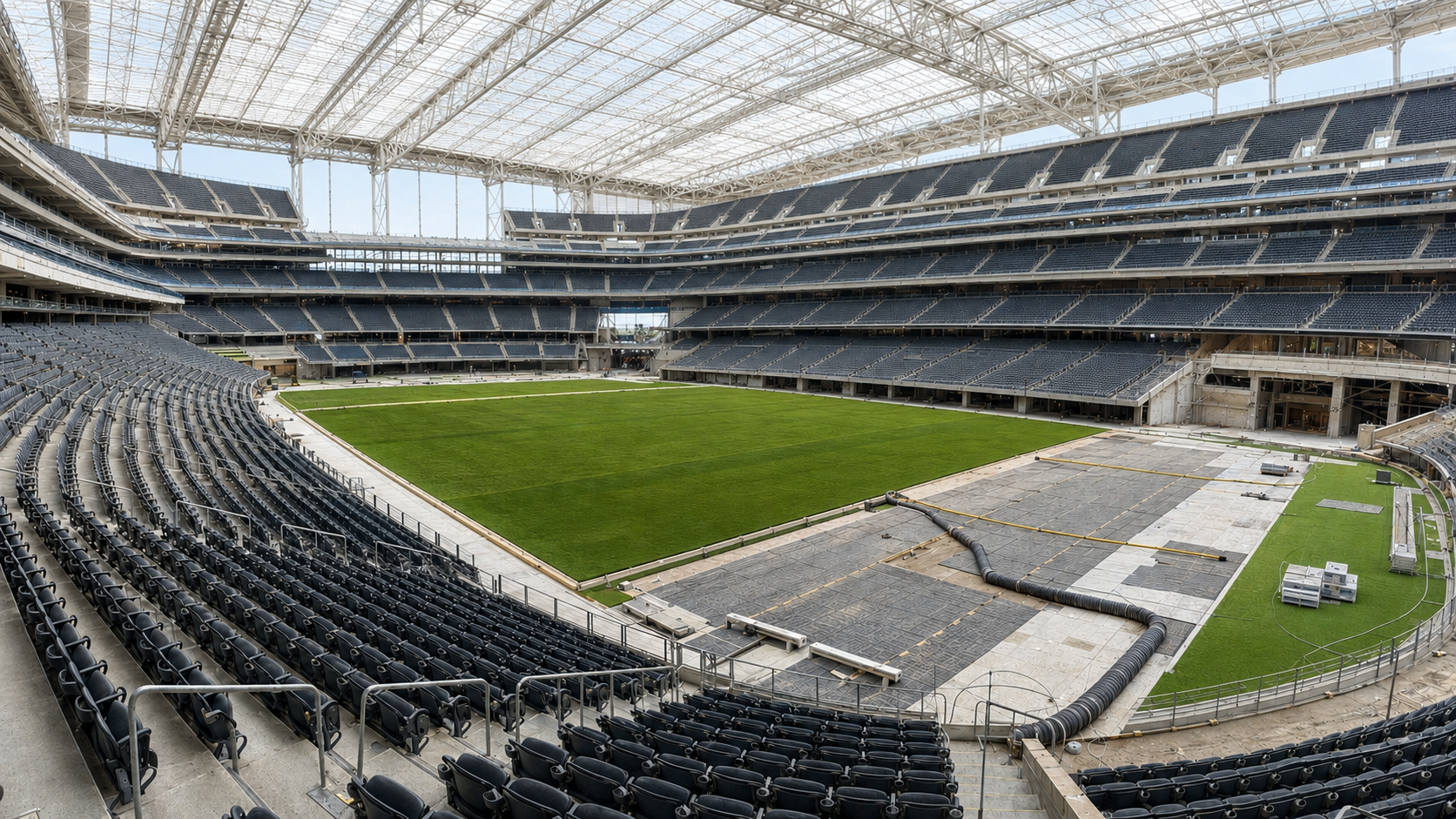 Existing stadium being converted with temporary natural grass and a wider soccer field for the 2026 World Cup.