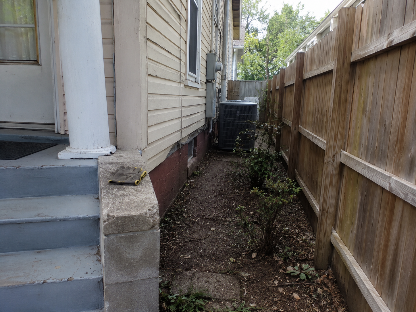 Tight side yard access making house raising work more complicated.