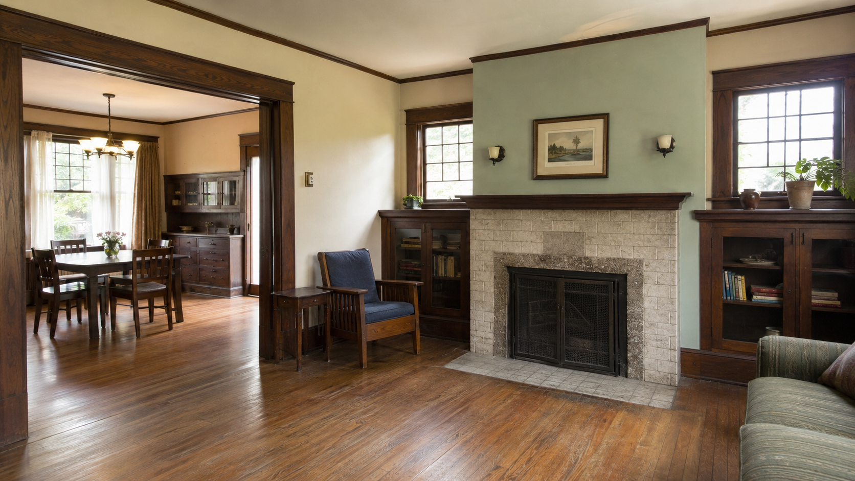 Craftsman interior with original wood trim, built-ins, windows, fireplace, and hardwood floors.