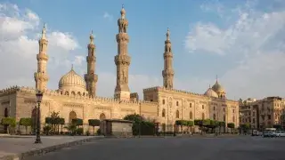Al-Azhar Mosque in Cairo, Egypt, showing domes, minarets, and historic stone architecture.