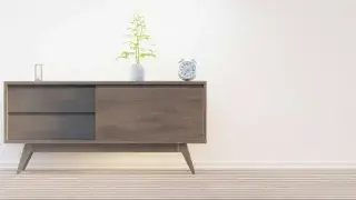 A sleek, minimalist drawer unit in the living room, offering clean lines and efficient storage.