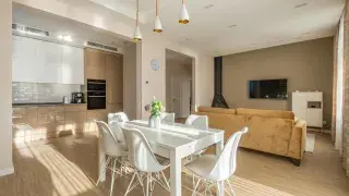 Modern interior with light wood floors and neutral-toned wall color creating a warm, balanced space.