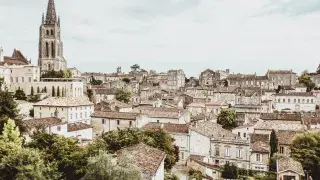 A complete medieval neighborhood in Saint Émilion, France, with stone houses and narrow cobblestone streets, reflecting historical architecture.