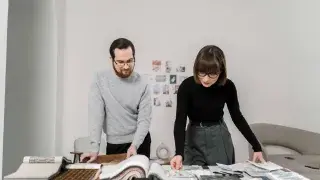 Architect and interior designer reviewing material samples.