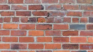 Weathered bricks with failing mortar.