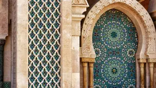 Moroccan Islamic tile fountain with horseshoe arches.