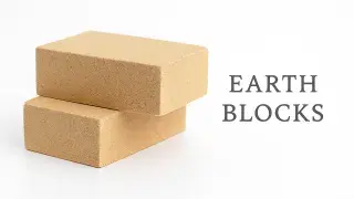 Two stacked earth blocks used as sustainable building materials.