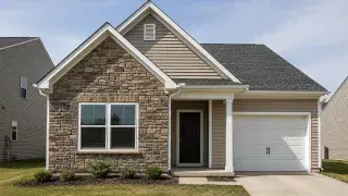 Suburban house with two front gables, stone veneer, siding, and attached garage.
