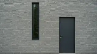 ontemporary house entrance with a narrow window on the left side of the main door.