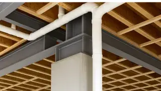 Structural floor system showing joists, beams, and subfloor layers.